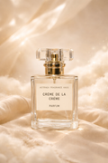 Astraea Fragrance Haus Crème De La Crème perfume bottle with elegant design and floral accents on a white background.