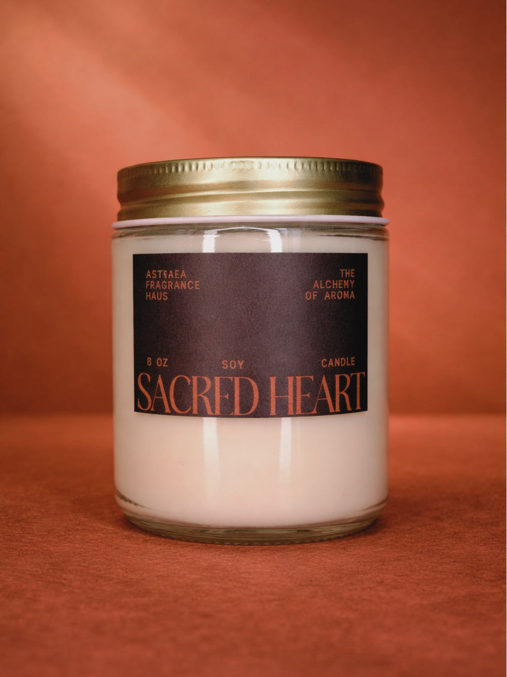 A close-up of the Sacred Heart perfume bottle from Astraea Fragrance Haus, showcasing its intricate design and elegant shape.