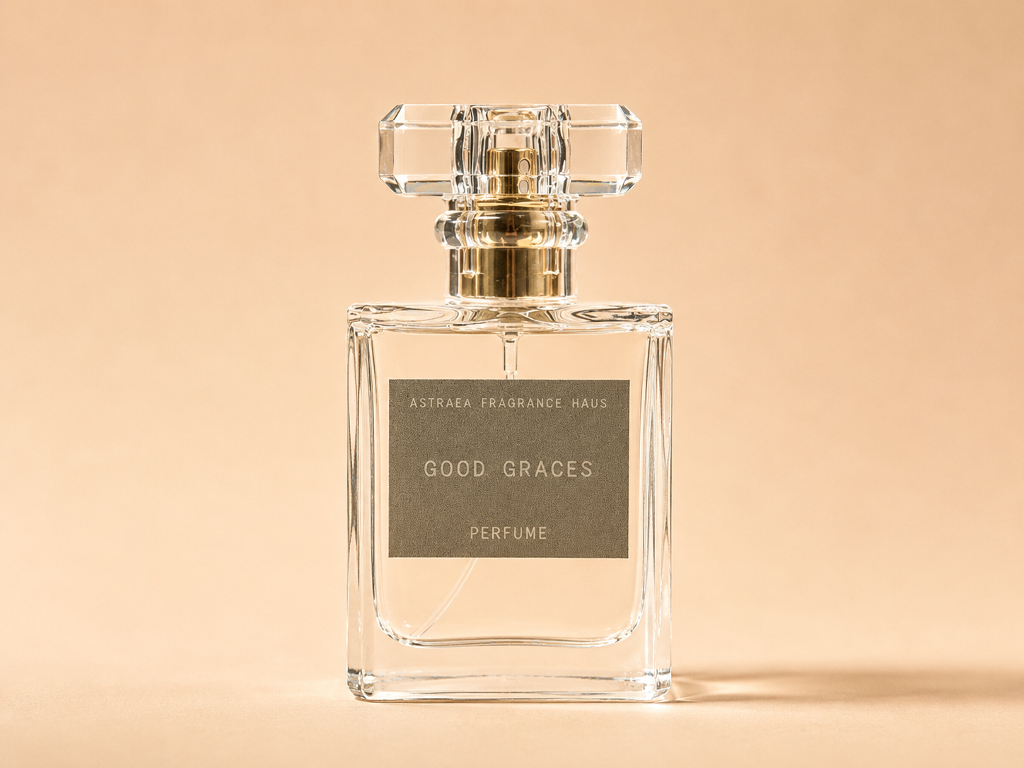 Astraea Fragrance Haus Good Graces perfume bottle with elegant design on a neutral background.