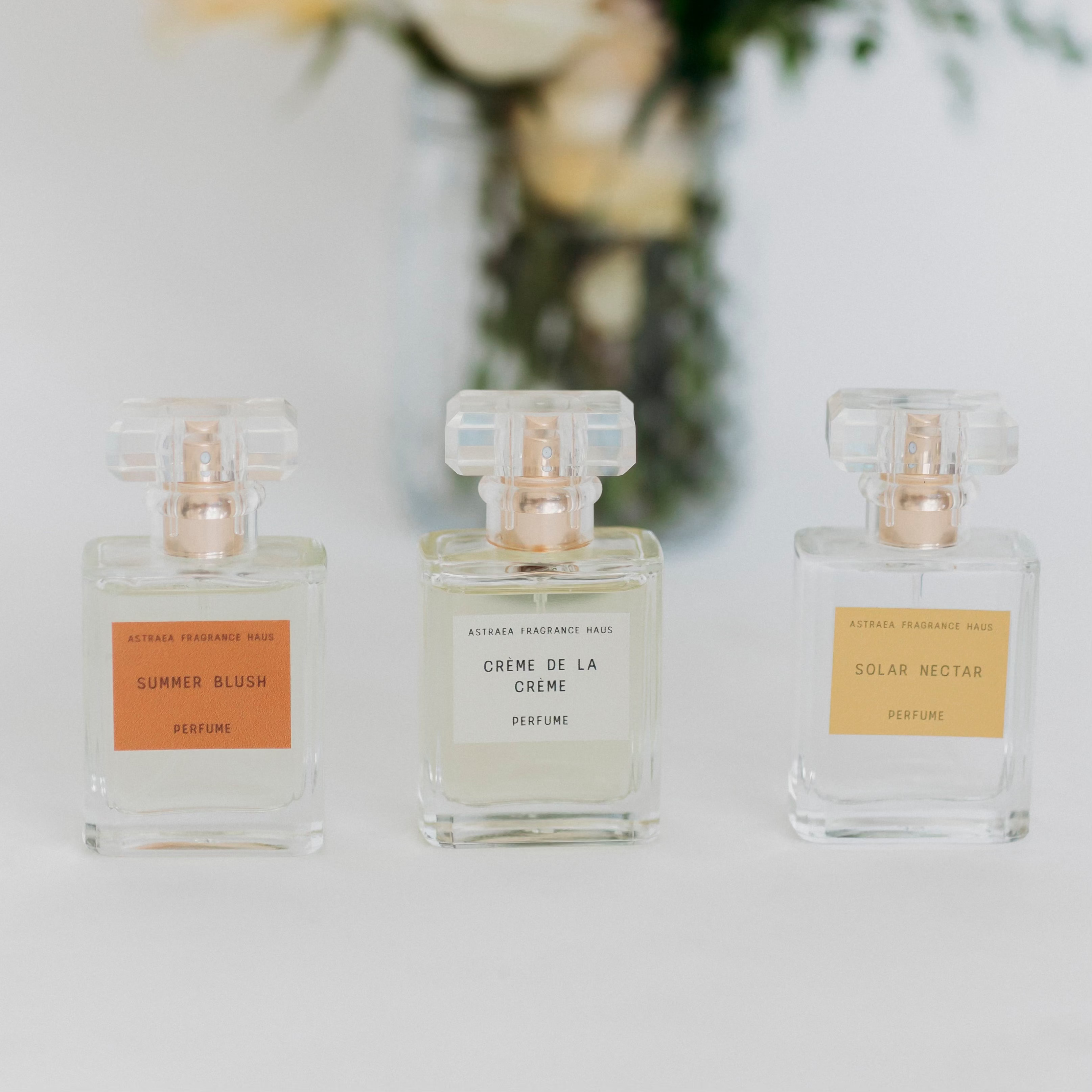 Asteracea Fragrance Haus Crème De La Crème perfume bottle with elegant design on a neutral background